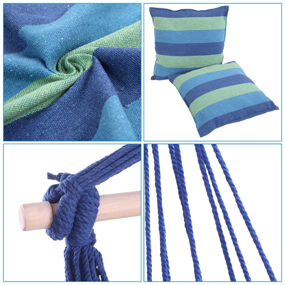 Distinctive blue striped cotton canvas hanging rope chair with pillows, designed for outdoor relaxation and comfort.