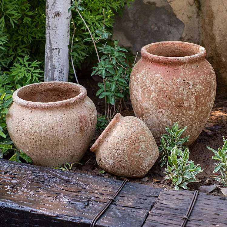 Distressed Cement Plant Pot in terracotta color, showcasing its rustic design and drainage hole.