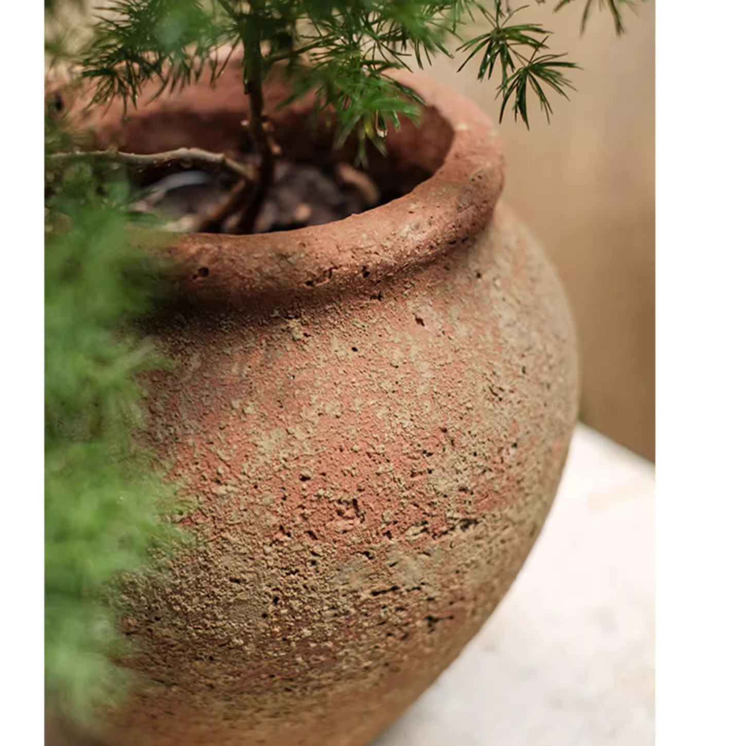 Distressed Cement Plant Pot in terracotta color, showcasing its rustic design and drainage hole.