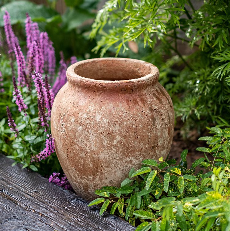 Distressed Cement Plant Pot in terracotta color, showcasing its rustic design and drainage hole.