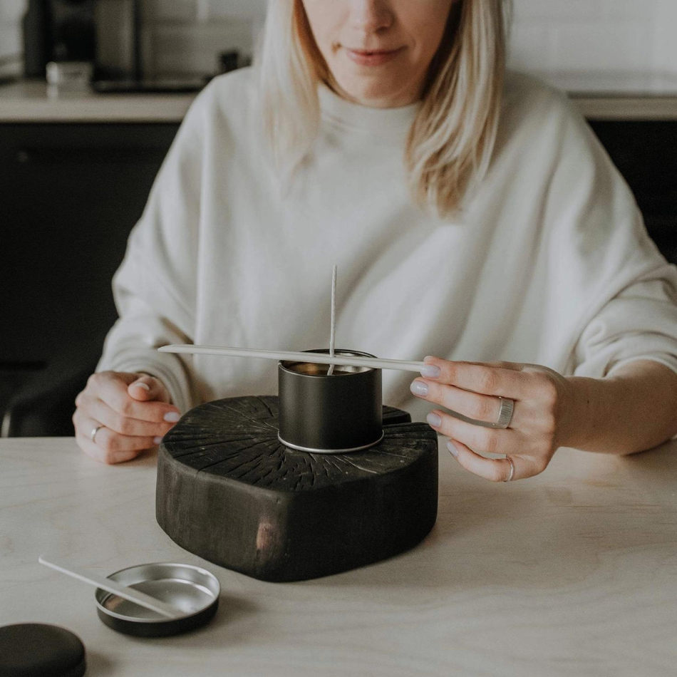 A beautifully arranged DIY Candle Making Kit featuring eco-friendly wax, natural scented oils, wicks, and metal containers.