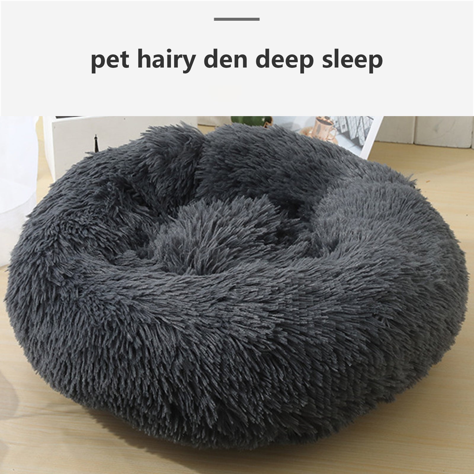 A dark gray plush round dog bed designed for comfort, featuring faux shag fur and a cozy nest shape for pets to snuggle into.