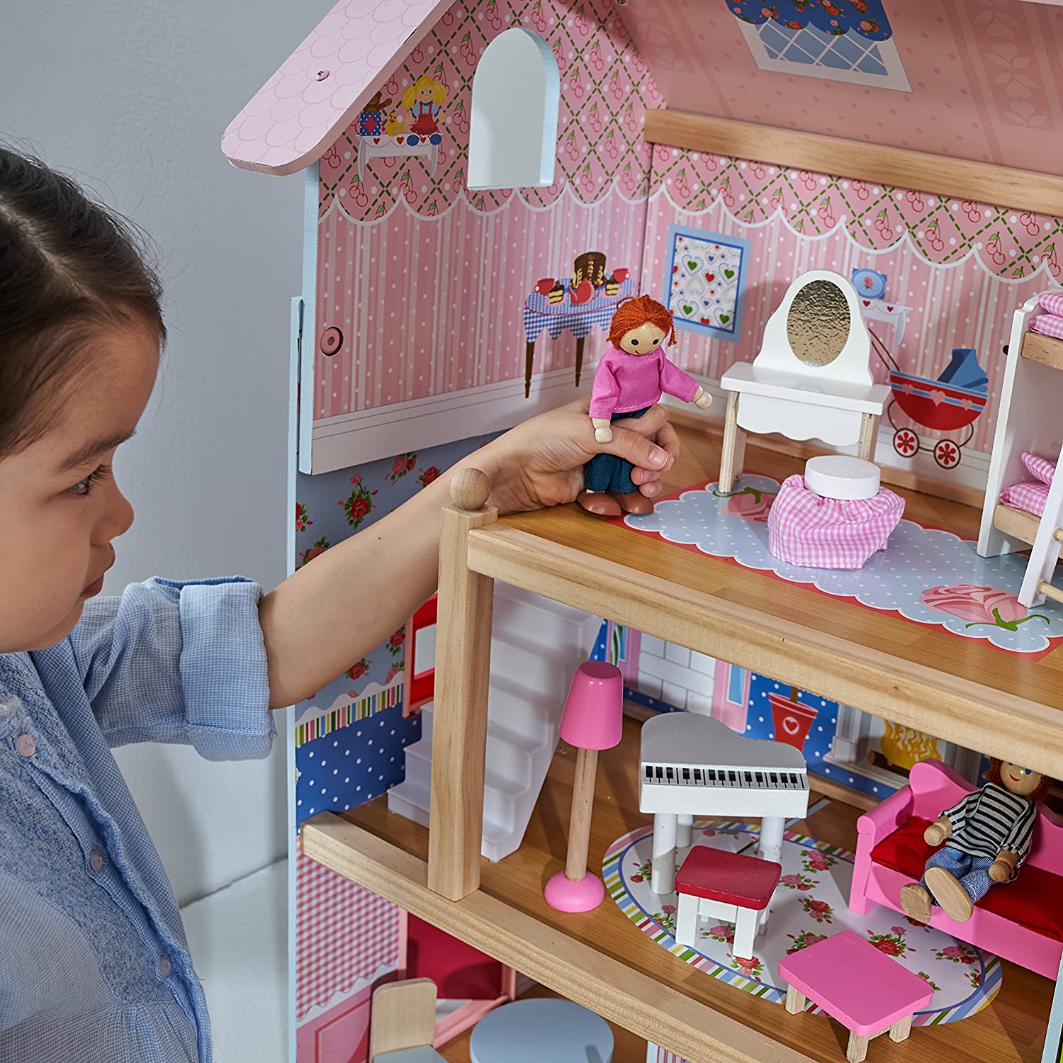 A colorful Doll Cottage with Furniture for kids, featuring three levels, five rooms, and a 16-piece furniture set, designed for imaginative play.