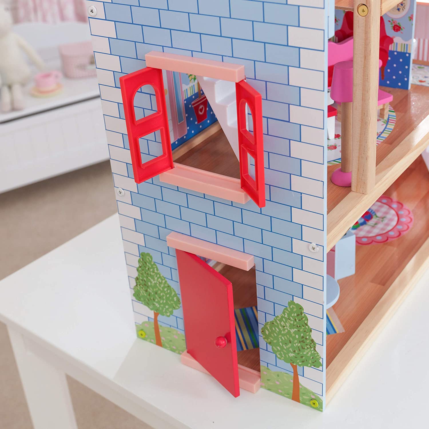 A colorful Doll Cottage with Furniture for kids, featuring three levels, five rooms, and a 16-piece furniture set, designed for imaginative play.