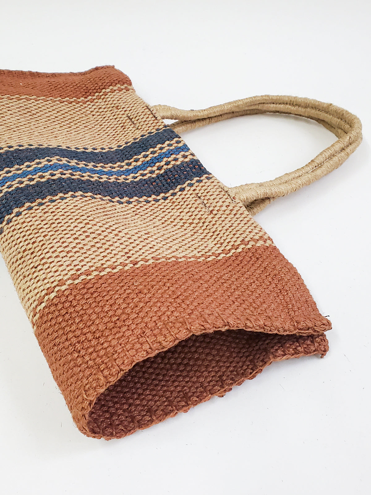 Dora Jute Tote Bag in multi light brown, showcasing handwoven jute fabric and rustic design.