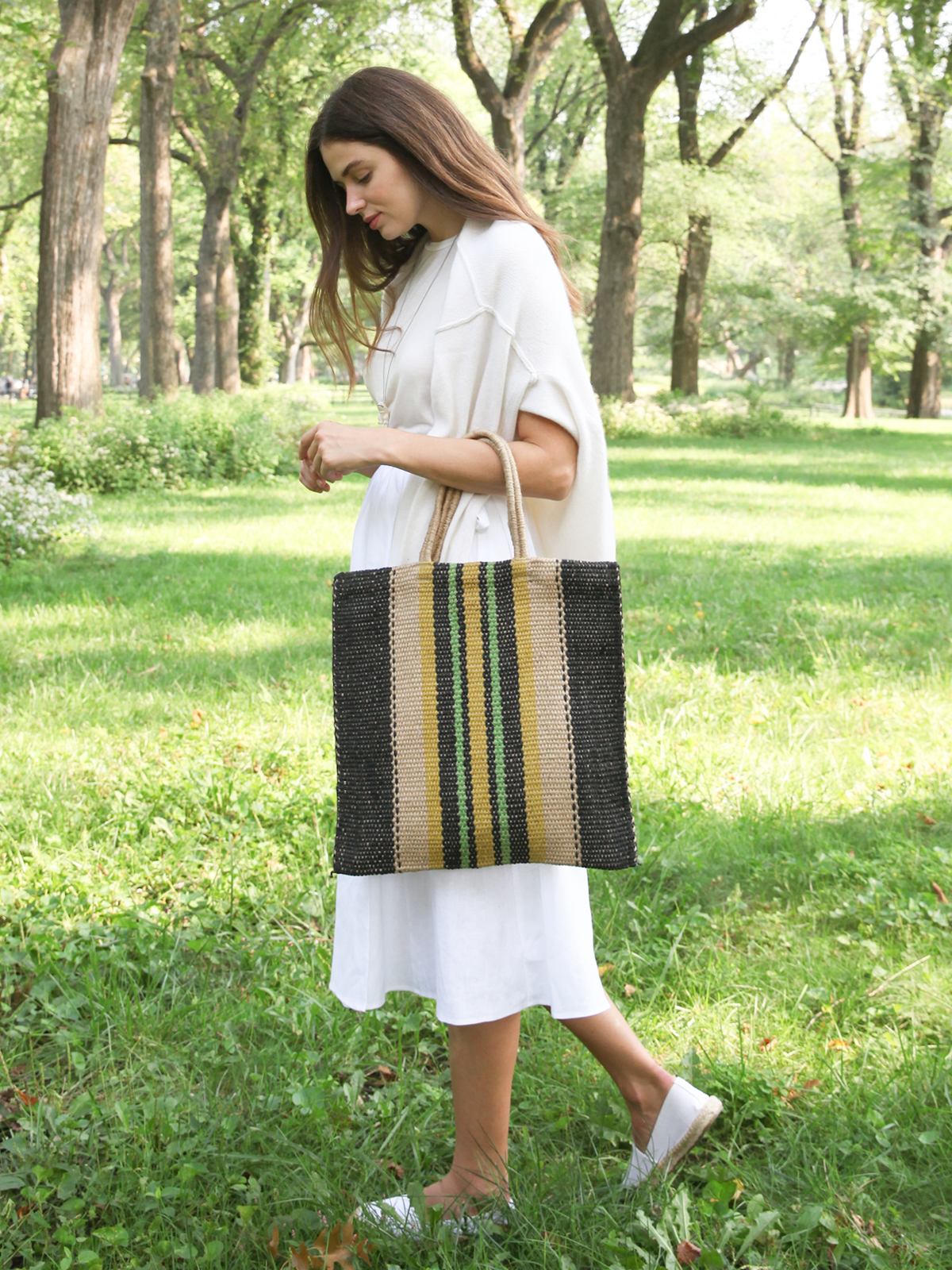 Dora Jute Tote Bag in Multi Navy, showcasing handwoven jute fabric with rustic detailing and vibrant colors.