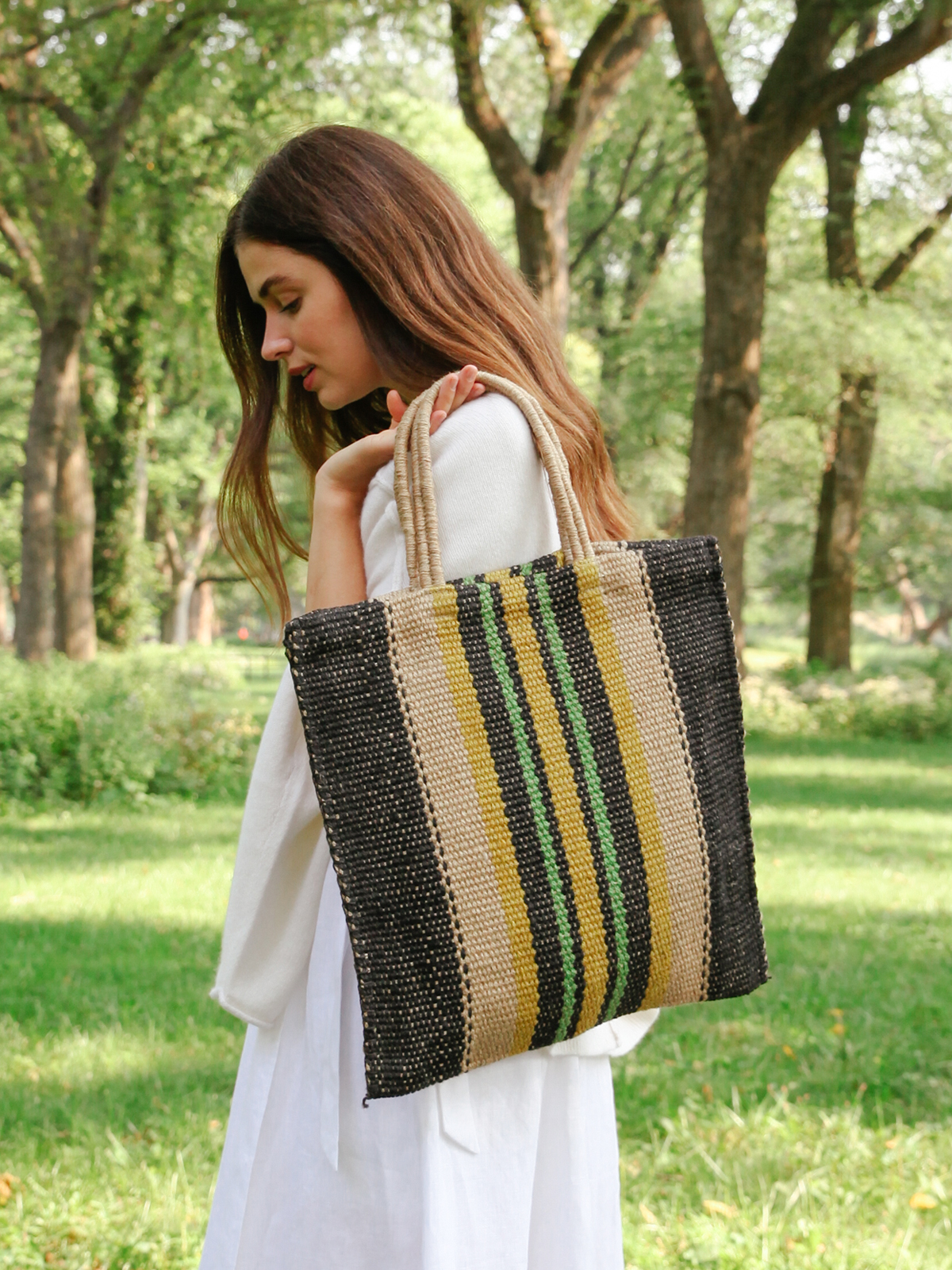 Dora Jute Tote Bag in Multi Navy, showcasing handwoven jute fabric with rustic detailing and vibrant colors.