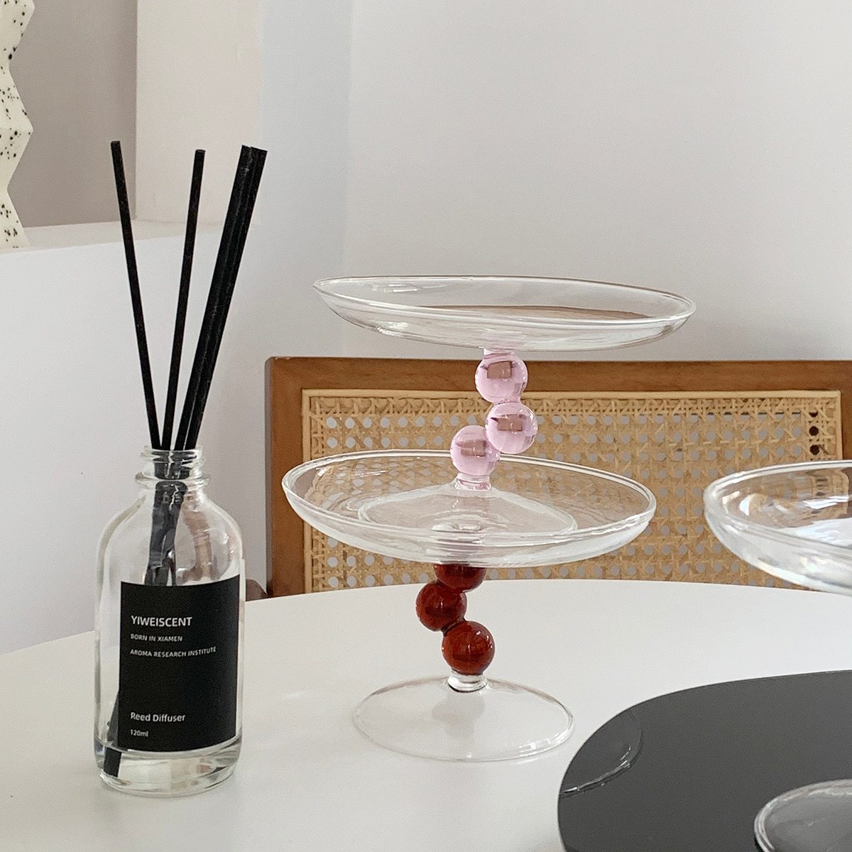 A vintage-inspired Dot Glass Catchall dish, elegantly designed to hold trinkets and jewelry, featuring a unique glass finish.