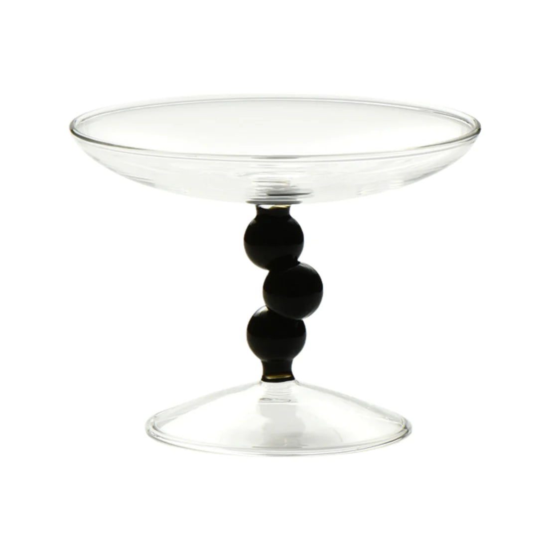 A vintage-inspired Dot Glass Catchall dish, elegantly designed to hold trinkets and jewelry, featuring a unique glass finish.