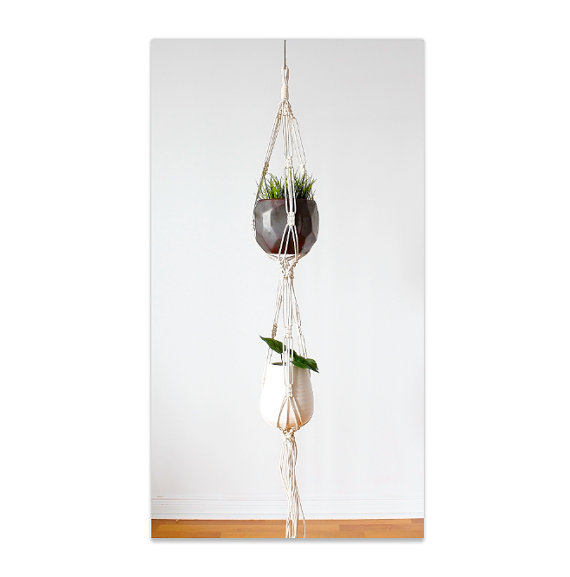 A beautifully crafted Double Macrame Plant Hanger made from 100% cotton rope, showcasing a stylish design perfect for indoor and outdoor plant display.