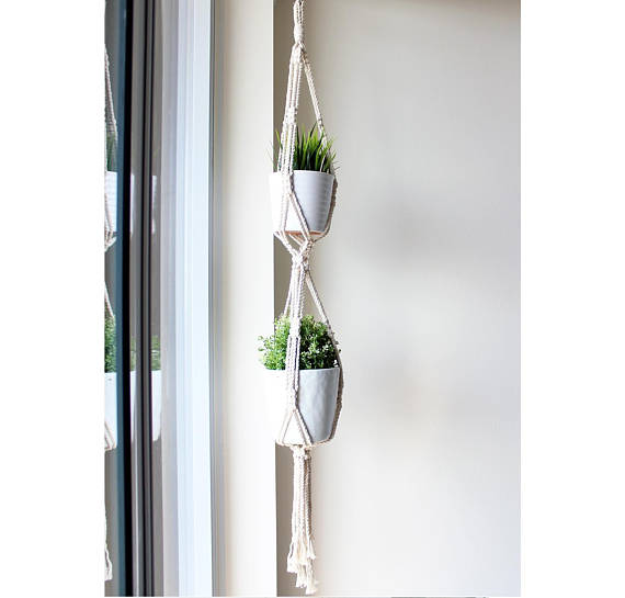 A beautifully crafted Double Macrame Plant Hanger made from 100% natural cotton rope, showcasing a small plant pot suspended elegantly.