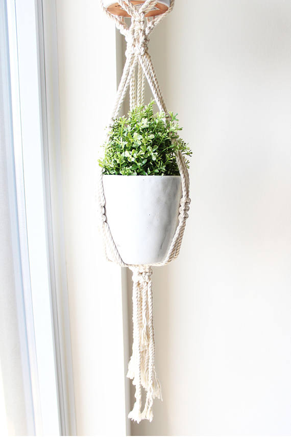 A beautifully crafted Double Macrame Plant Hanger made from 100% natural cotton rope, showcasing a small plant pot suspended elegantly.