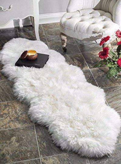 A luxurious Double Sheepskin Rug made from two soft lambskins, showcasing its plush texture and available in various natural colors.