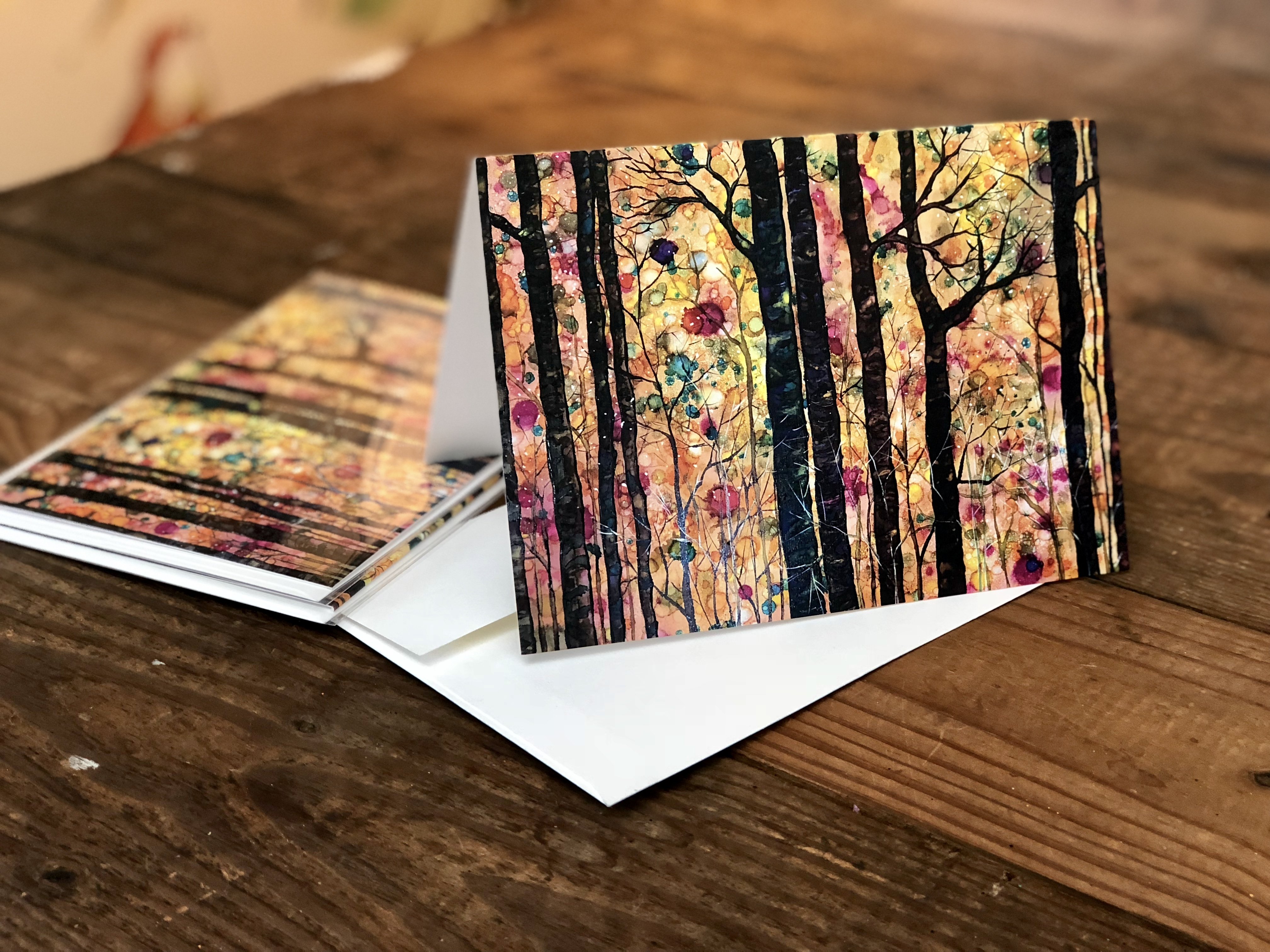 Dream Forest greeting card featuring vibrant mixed media art with intricate details and soothing colors, accompanied by a matching white envelope.