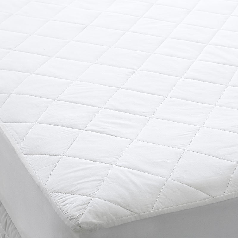 Dreamaker Thermaloft Cotton Covered Fitted Mattress Protector for double beds, featuring a soft cotton cover and elasticised skirt for a secure fit.