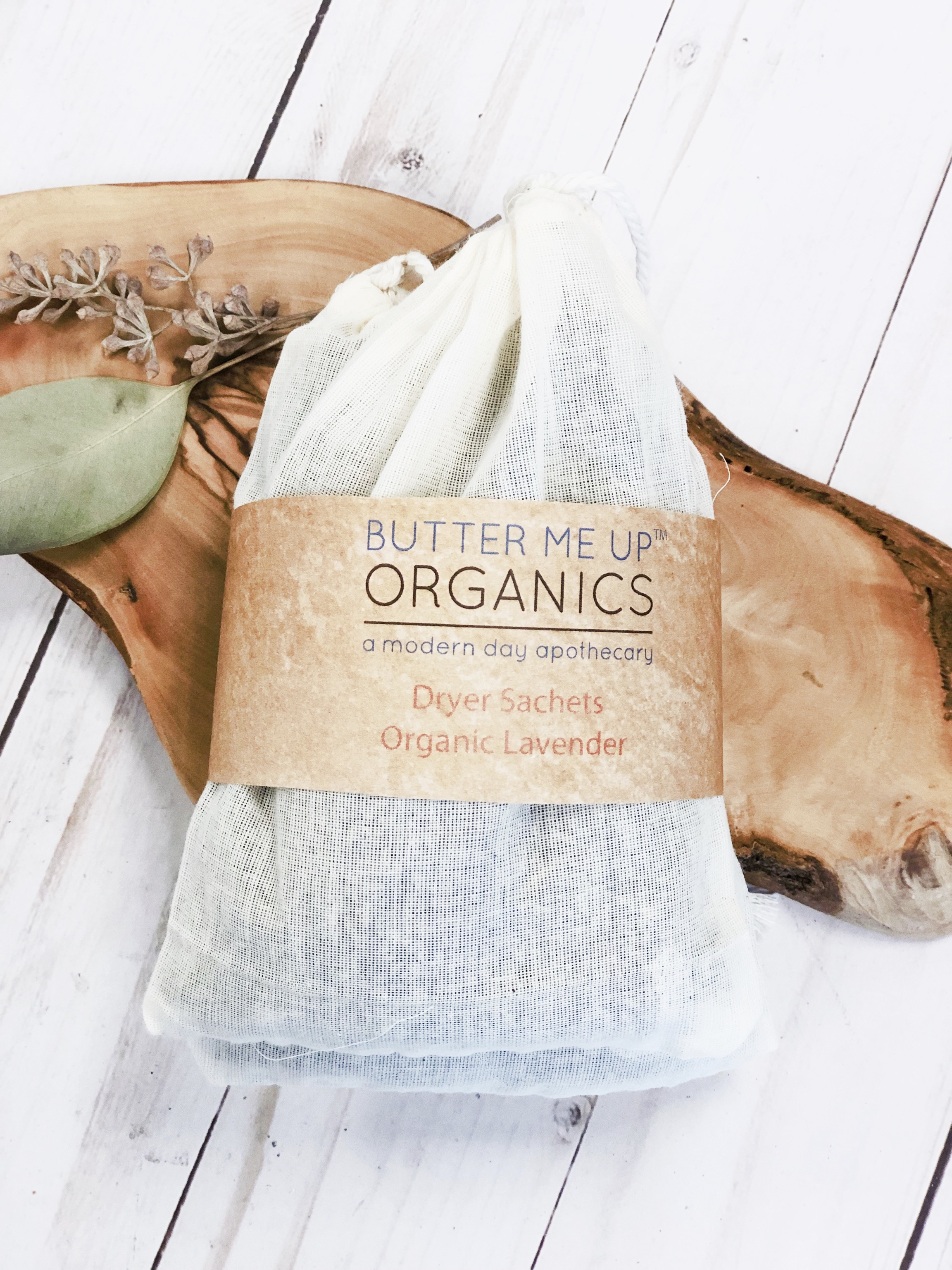 Two organic lavender dryer sachets in unbleached muslin bags, designed for freshening laundry naturally.