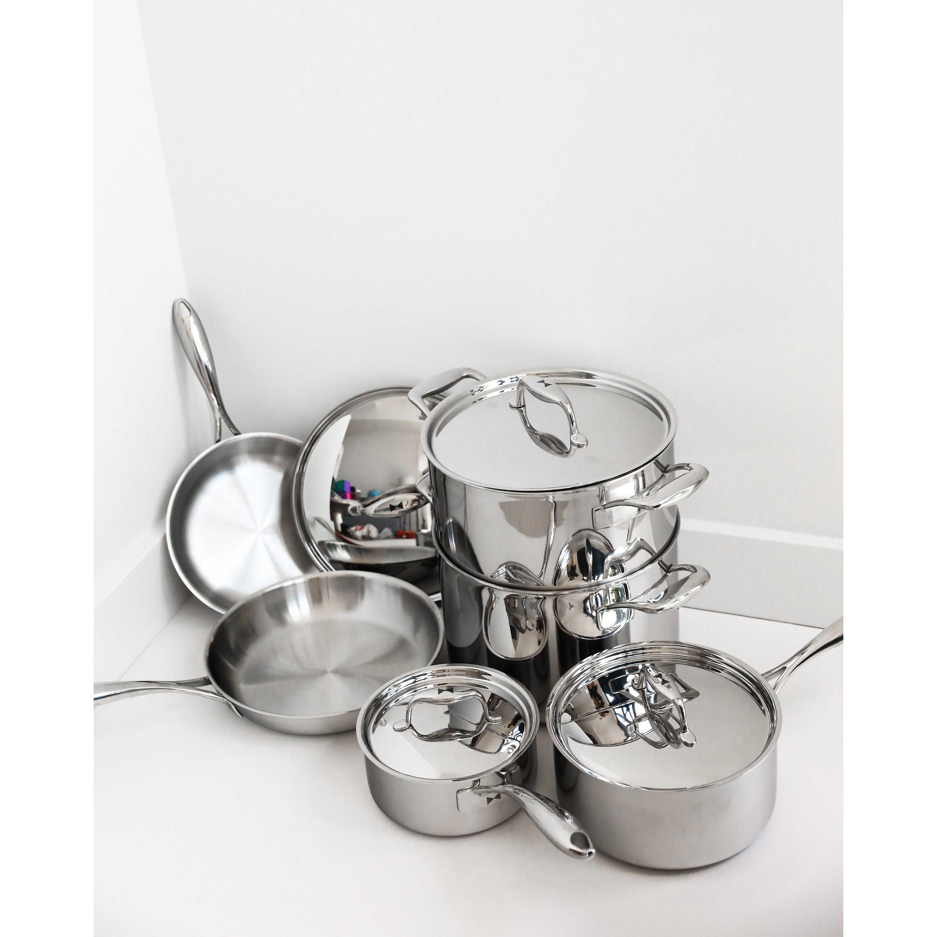 Duratux Tri-Ply Cookware Set featuring various pots and pans in stainless steel finish.