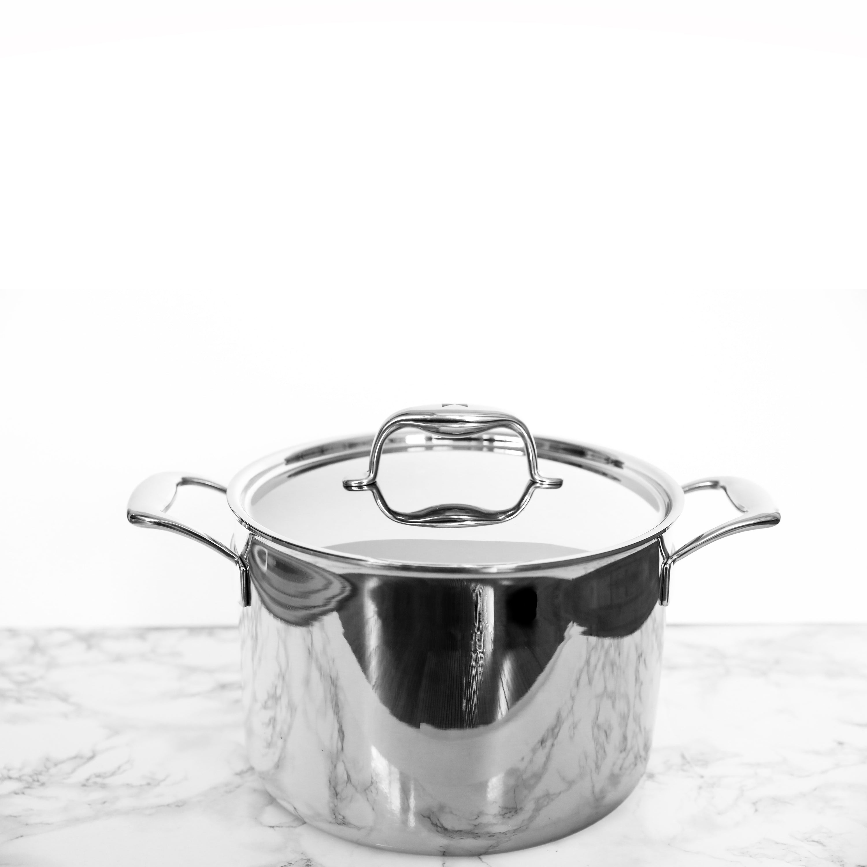 Duratux Tri-Ply Cookware Set featuring various pots and pans in stainless steel finish.