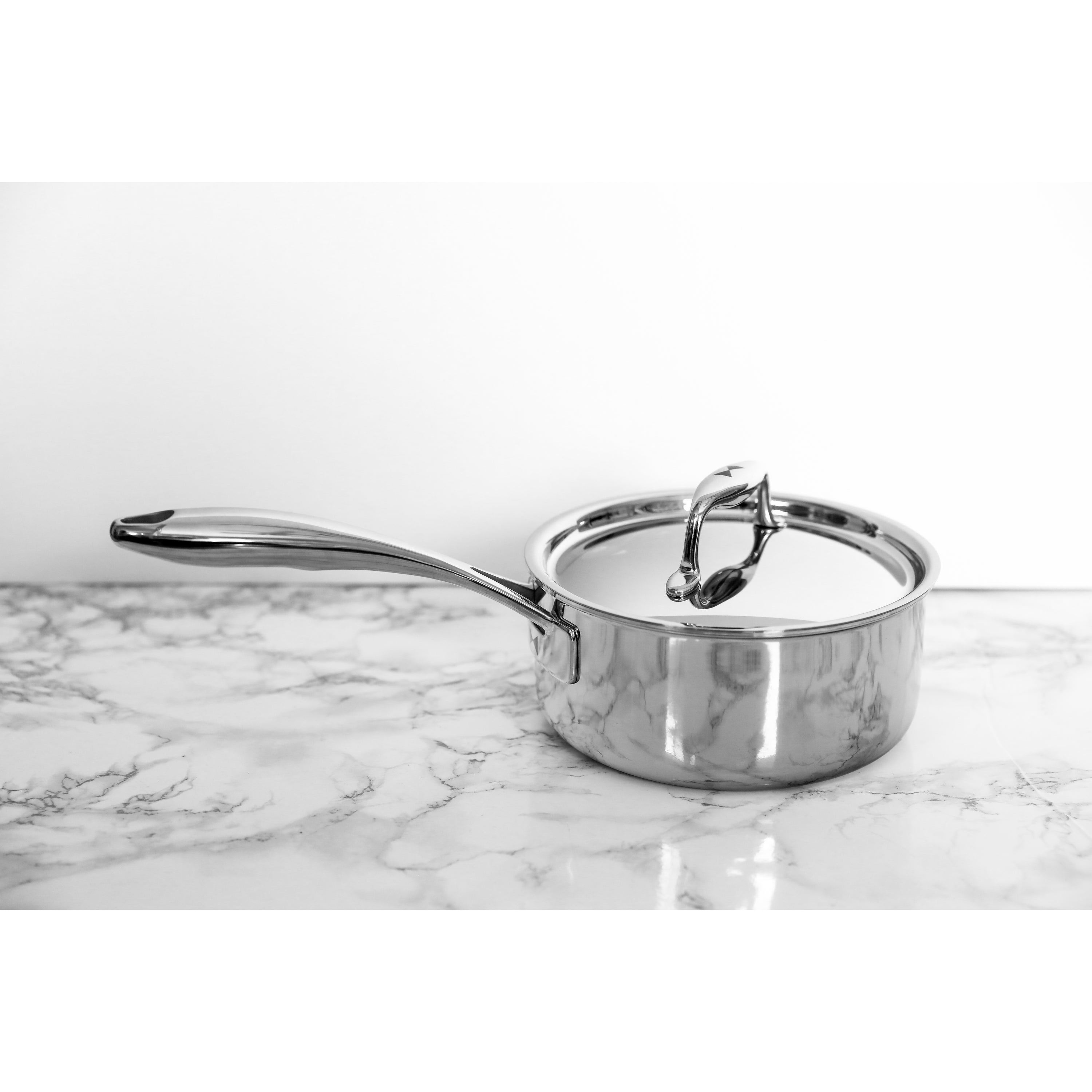 Duratux Tri-Ply Cookware Set featuring various pots and pans in stainless steel finish.