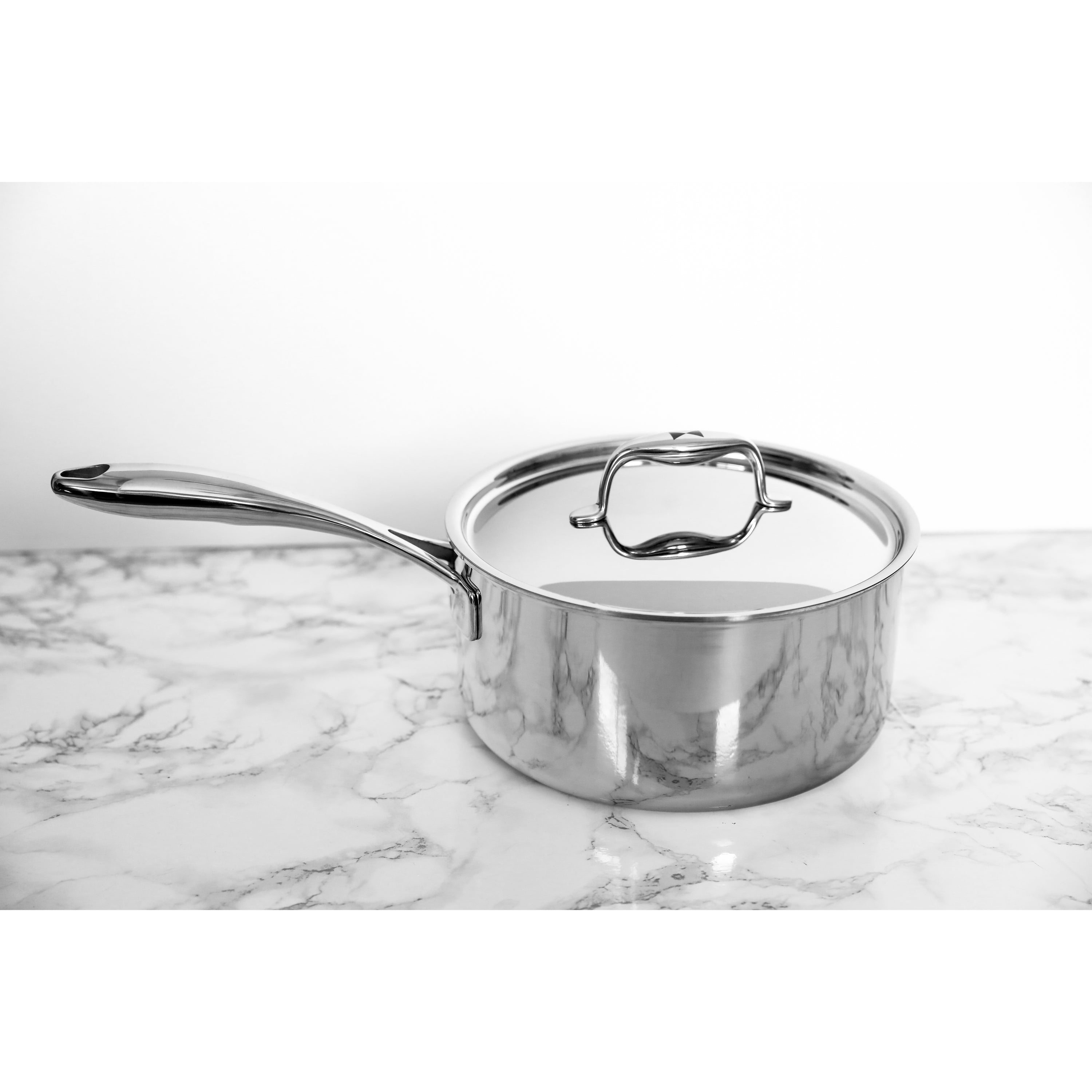 Duratux Tri-Ply Cookware Set featuring various pots and pans in stainless steel finish.