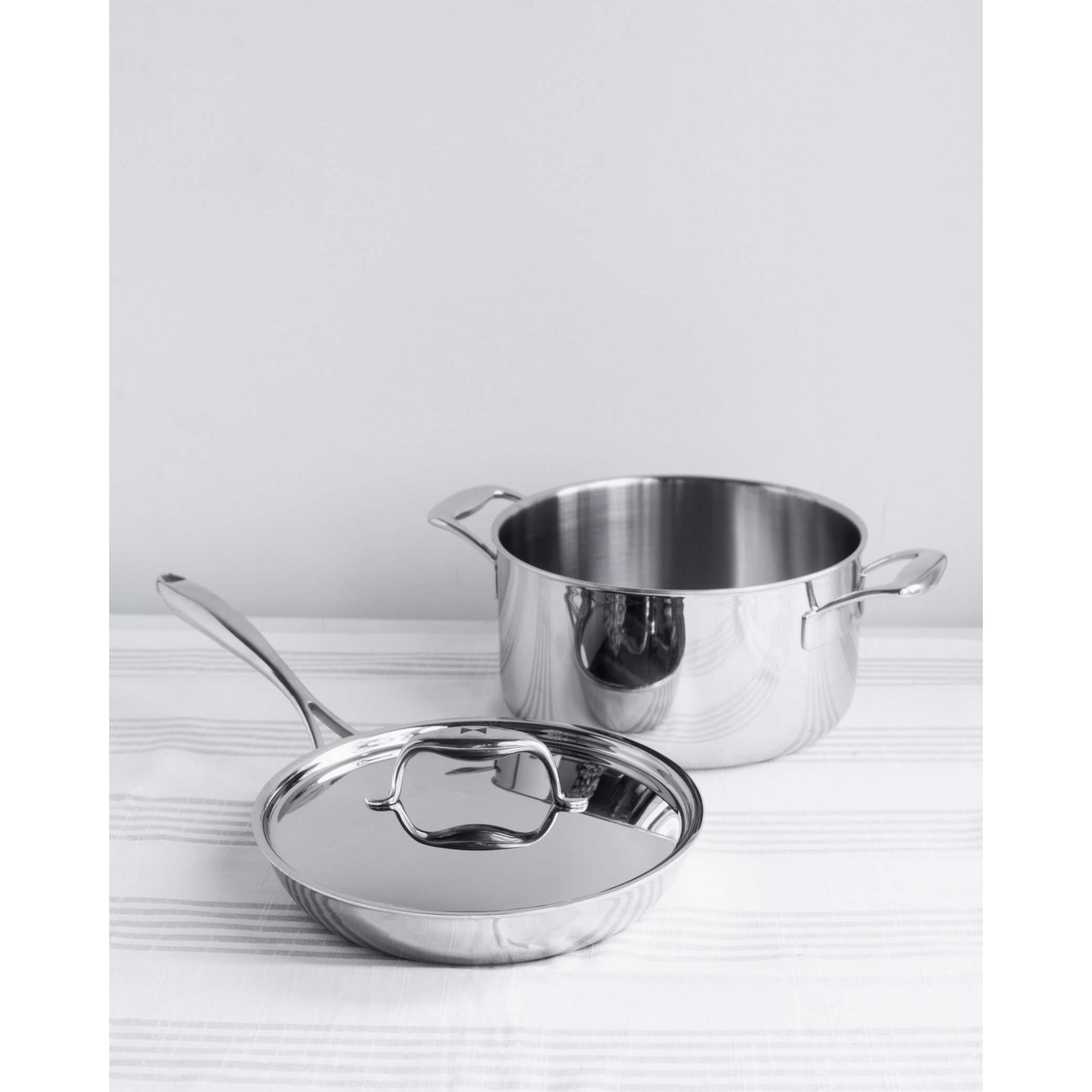 Duratux Tri-Ply Cookware Set featuring various pots and pans in stainless steel finish.