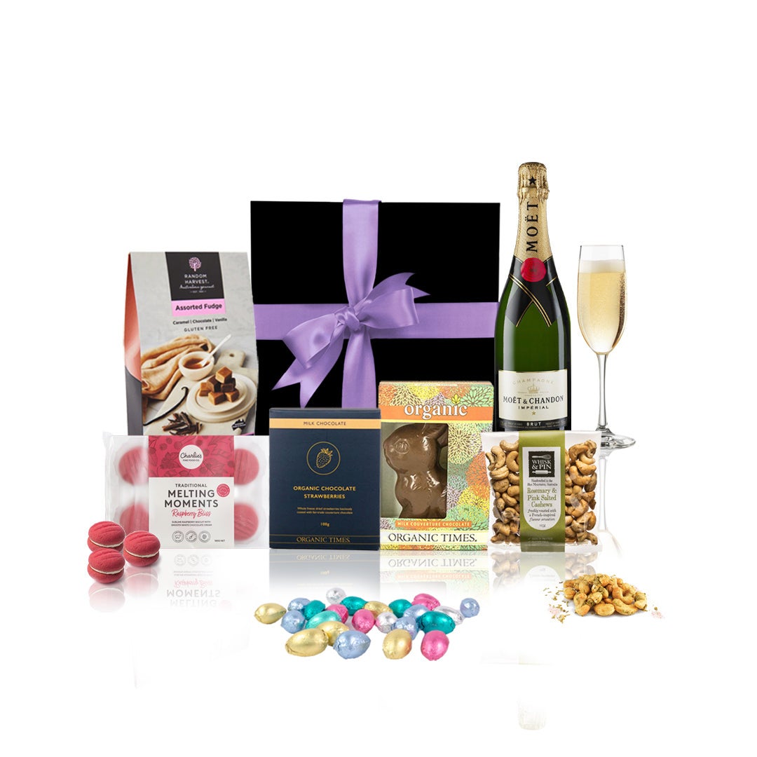 Easter & Champagne Gift Hamper featuring Moet & Chandon and assorted chocolates in an elegant black box with a purple bow.