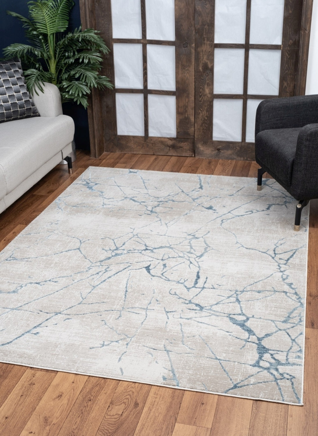 Elegance Blue Area Rug measuring 5 ft. 3 in. x 7 ft. 3 in., featuring a soft beige color and modern design, perfect for enhancing home decor.