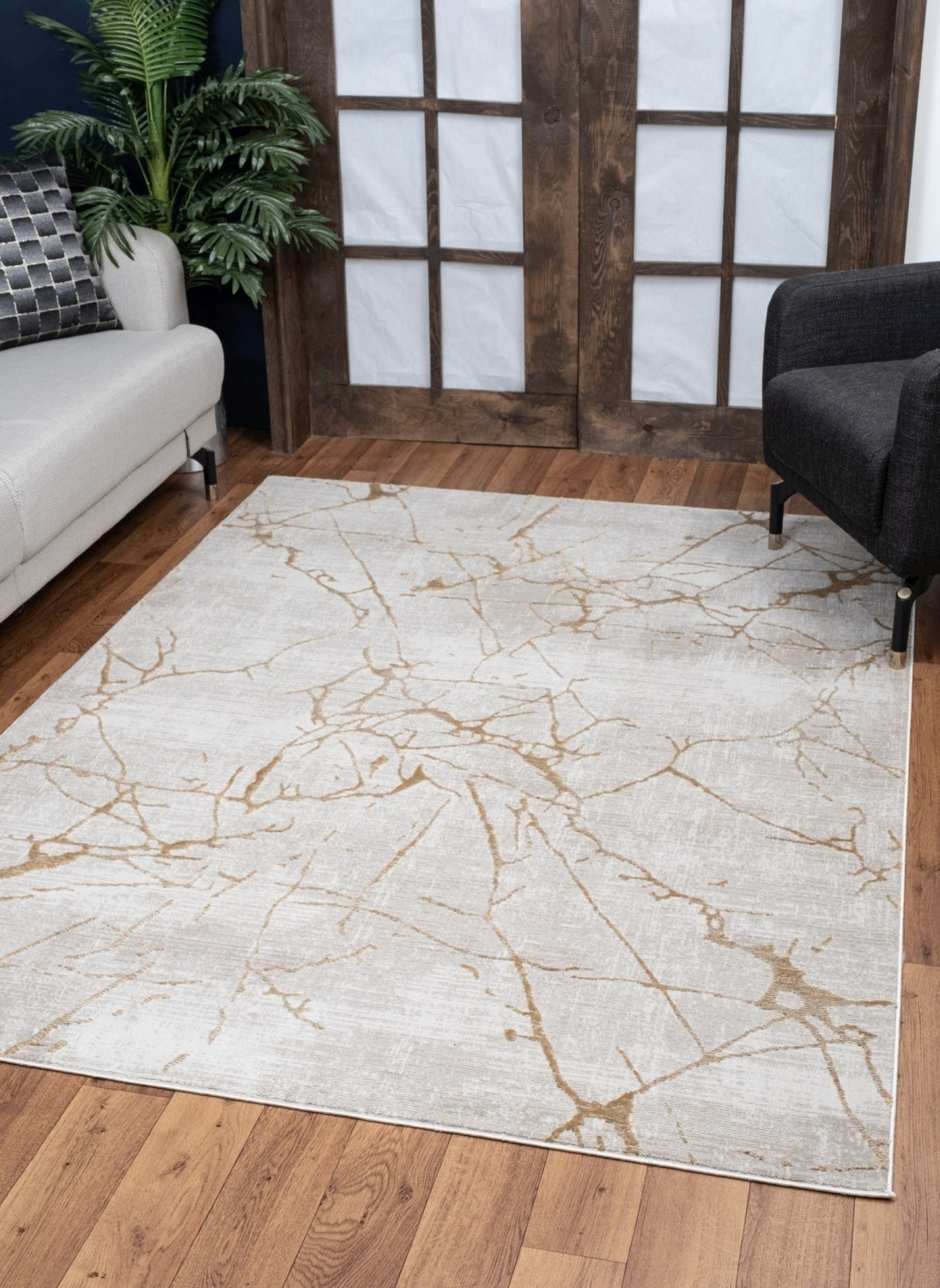 Elegance Gold Area Rug measuring 5 ft. 3 in. x 7 ft. 3 in., featuring a beige color and soft polyester material, perfect for enhancing home decor.