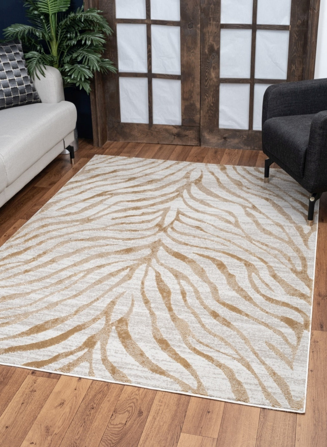 Elegance Gold Area Rug measuring 5 ft. 3 in. x 7 ft. 3 in., featuring a luxurious gold color and soft polyester material, ideal for home decor.