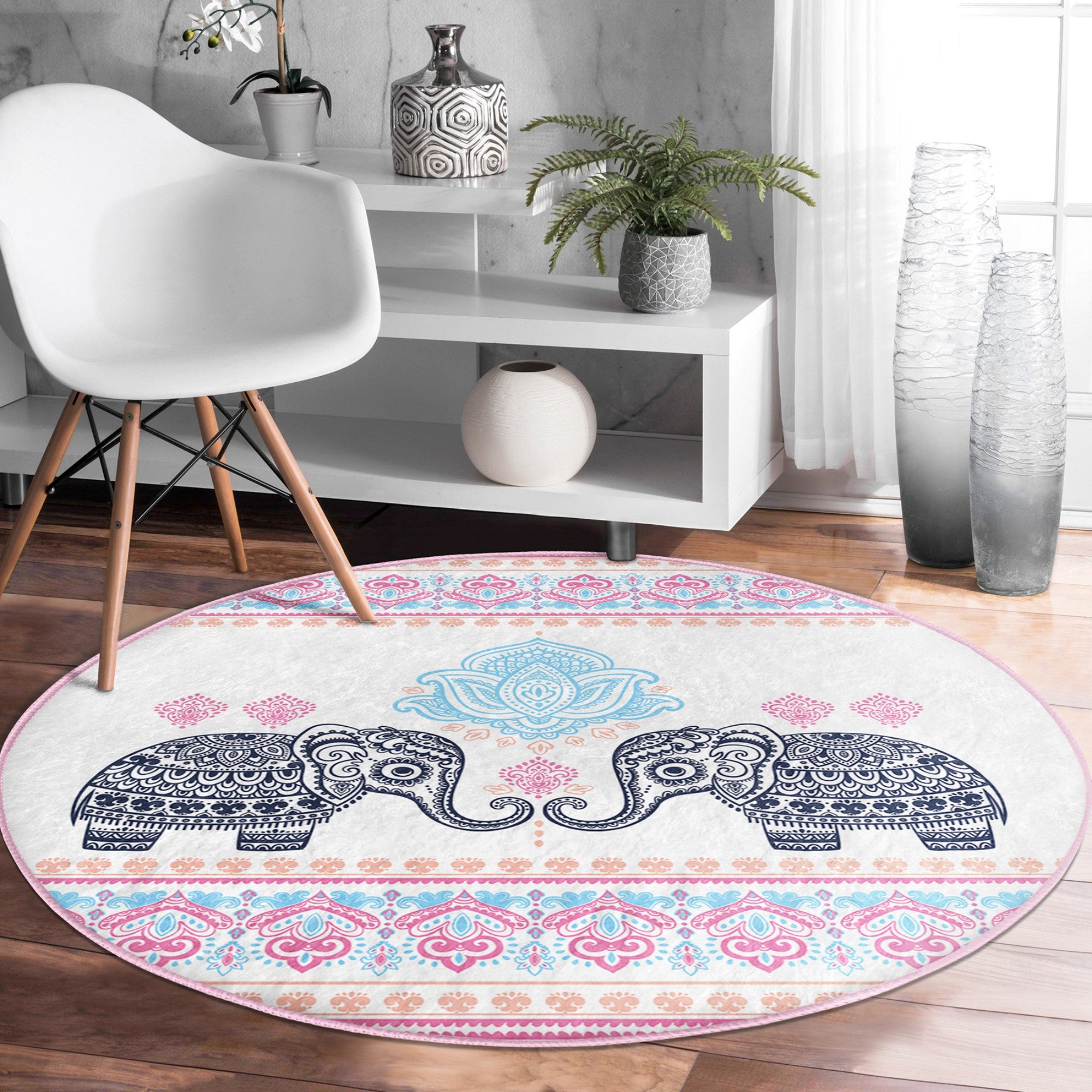 A beautifully designed round rug featuring an intricate elephant pattern, perfect for meditation rooms, showcasing vibrant colors and a soft texture.