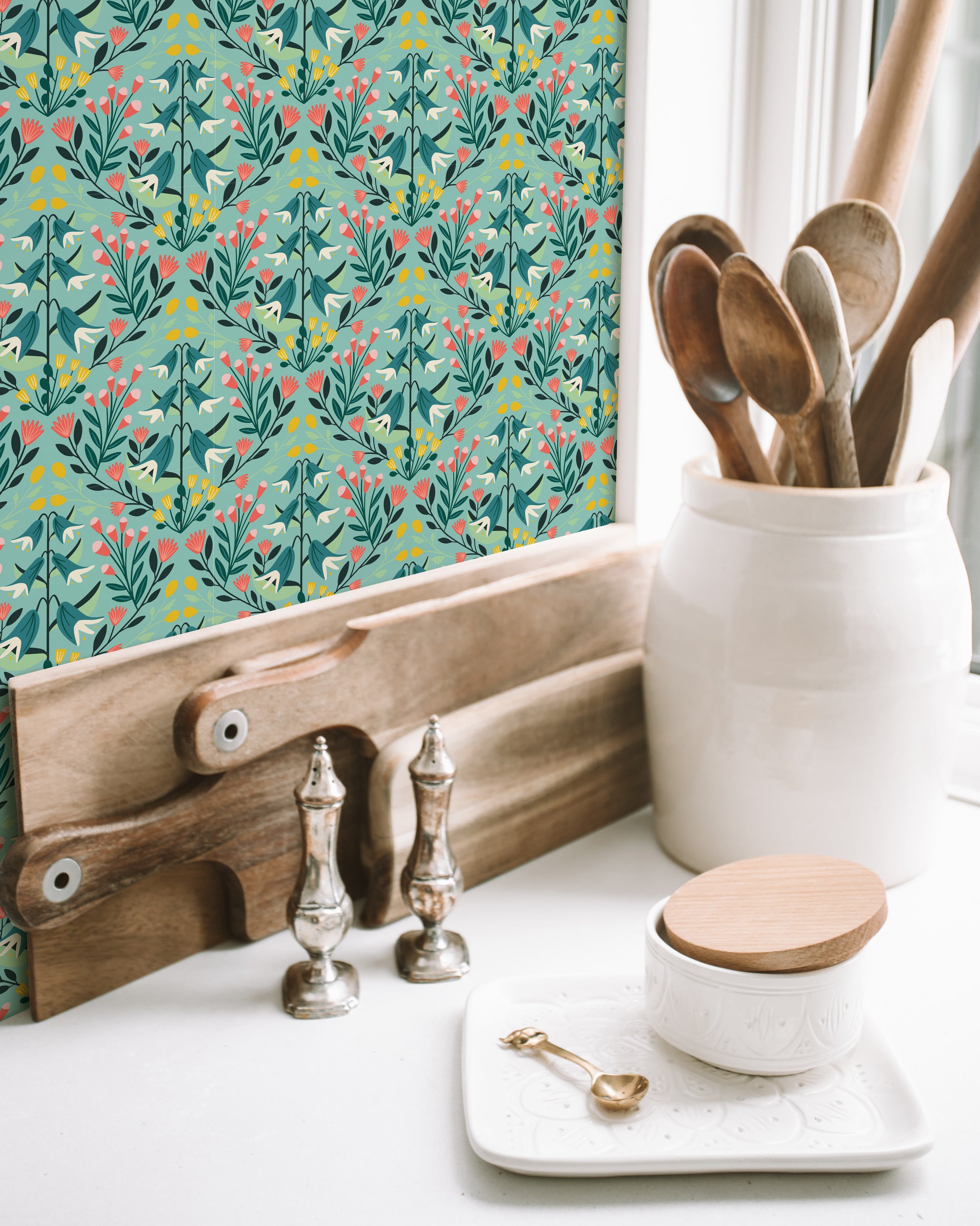 Eloise Teal Wallpaper featuring a modern design with vibrant teal colors and intricate patterns, perfect for home decor.