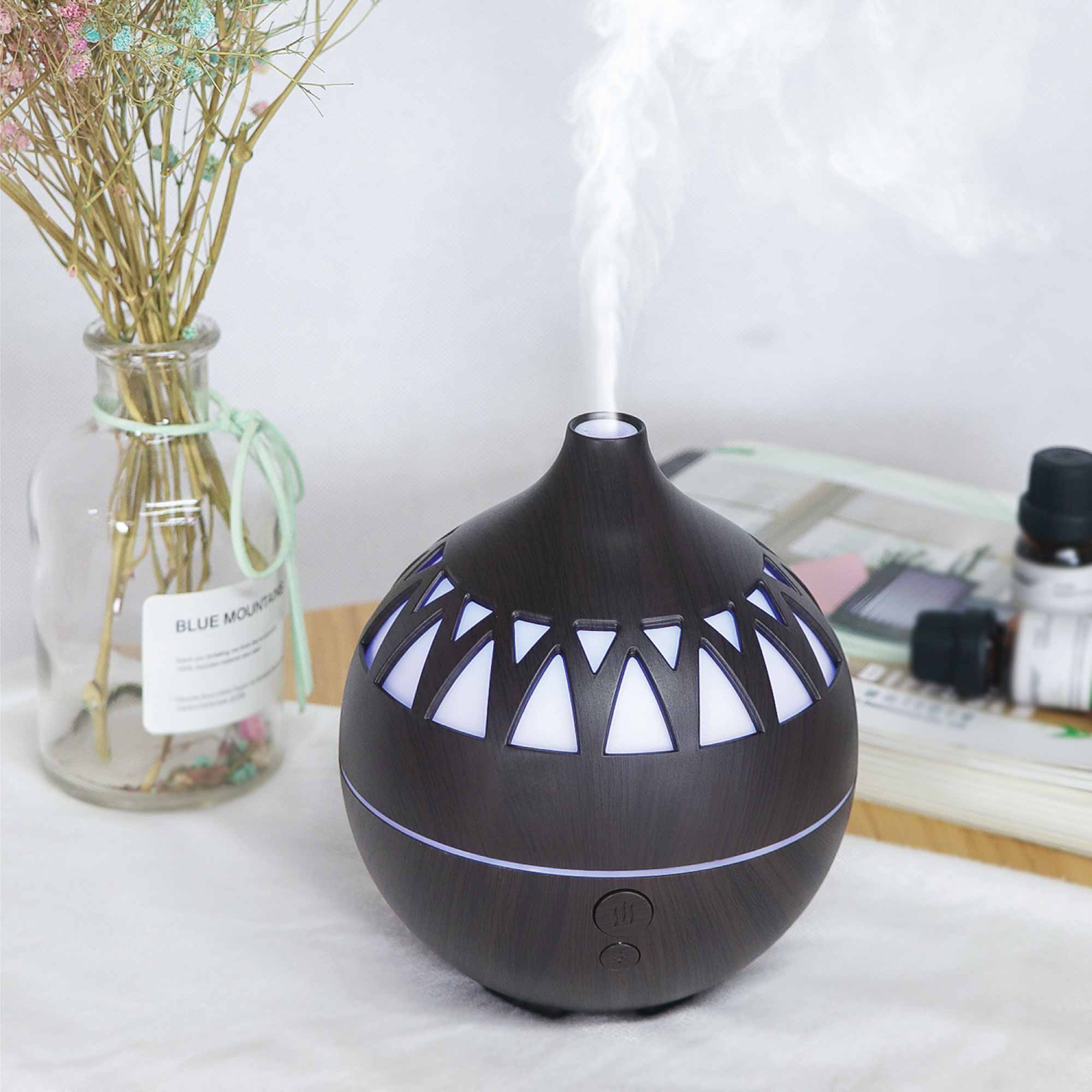 Essential Oil Aroma Diffuser in dark wood finish with LED lights, designed for aromatherapy and humidification.