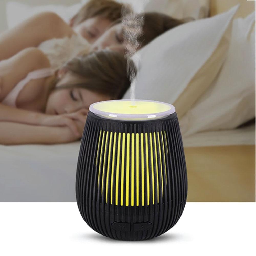 Black 100ml Essential Oil Aroma Diffuser with USB, featuring a stylish carving design and 7 LED color changing lights.