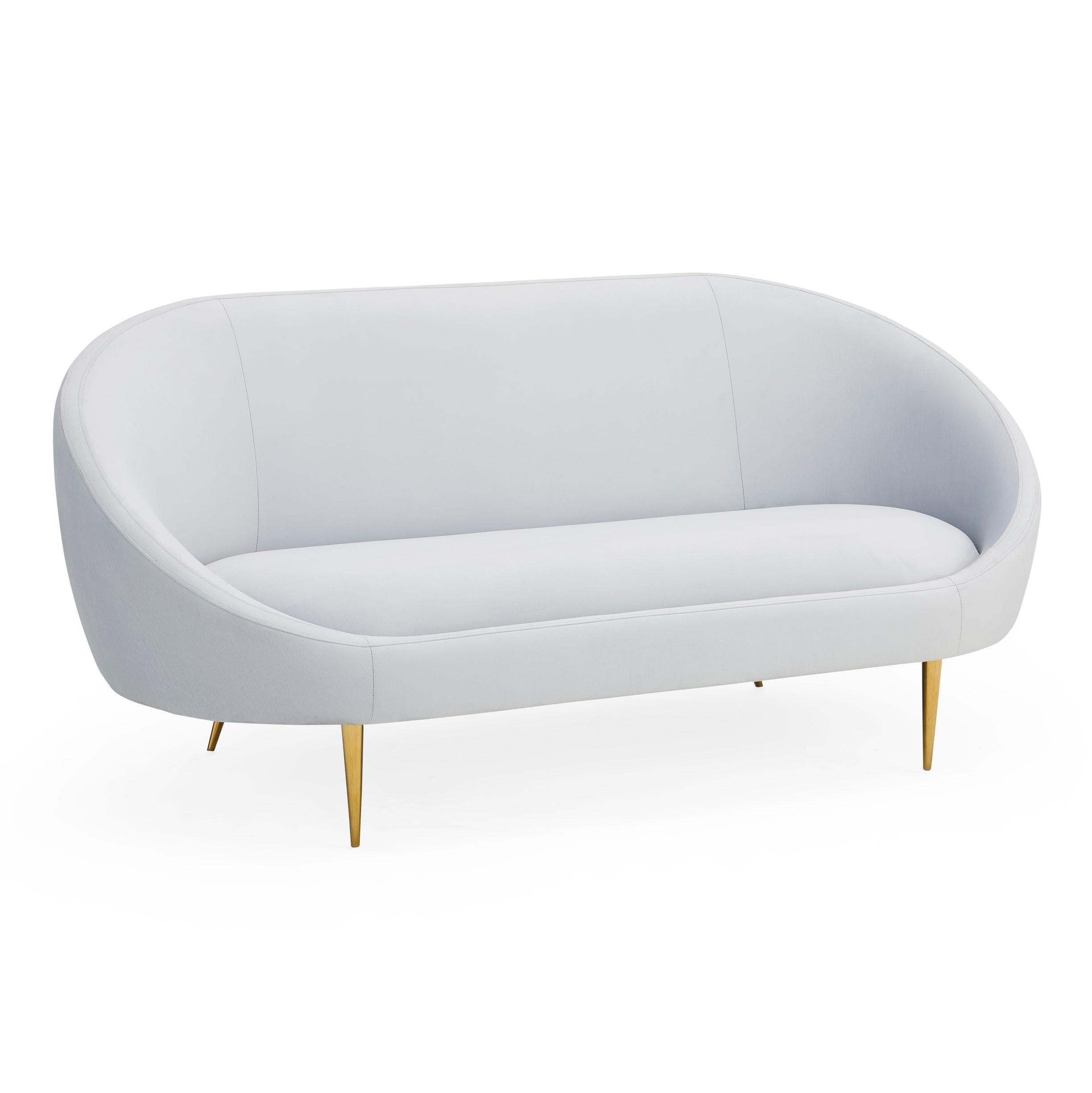 Ether Apartment Sofa featuring icy velvet upholstery and brass stiletto legs, designed for comfort and elegance.