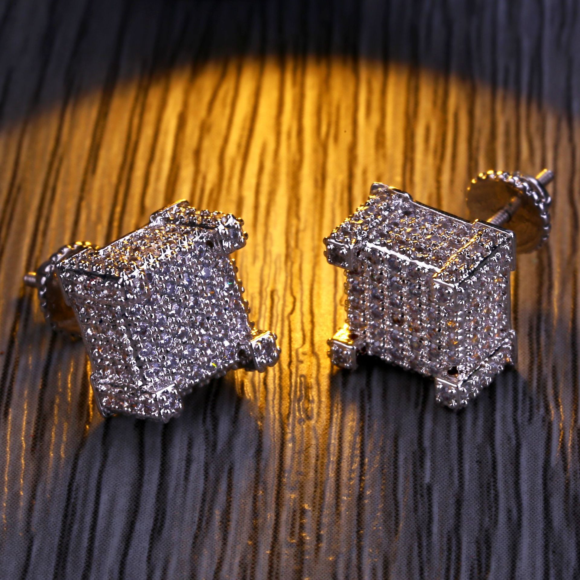 Stylish gold plated hip hop men's earrings featuring tiny zirconia studs in a heart pattern, available in silver and gold.