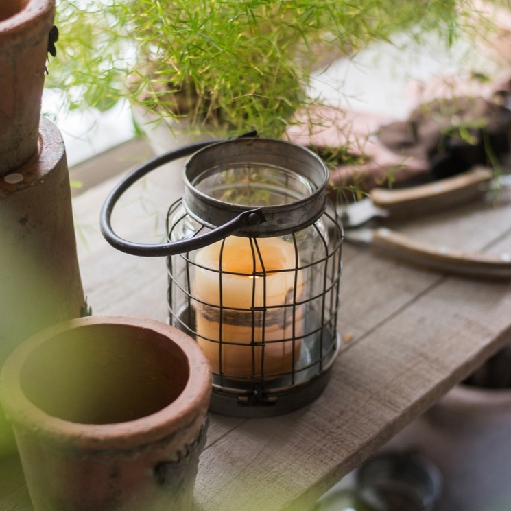 European Restoration Candle Holder in gray and rust, made of glass and metal, showcasing its elegant design and dimensions.