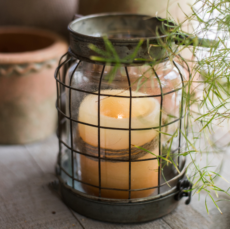 European Restoration Candle Holder in gray and rust, made of glass and metal, showcasing its elegant design and dimensions.