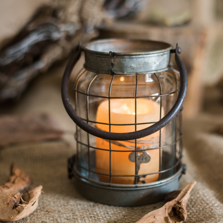 European Restoration Candle Holder in gray and rust, made of glass and metal, showcasing its elegant design and dimensions.