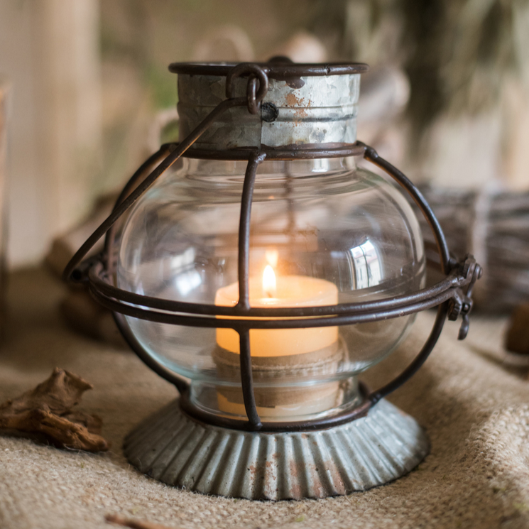 European Restoration Candle Holder in gray and rust, made of glass and metal, showcasing its elegant design and dimensions.