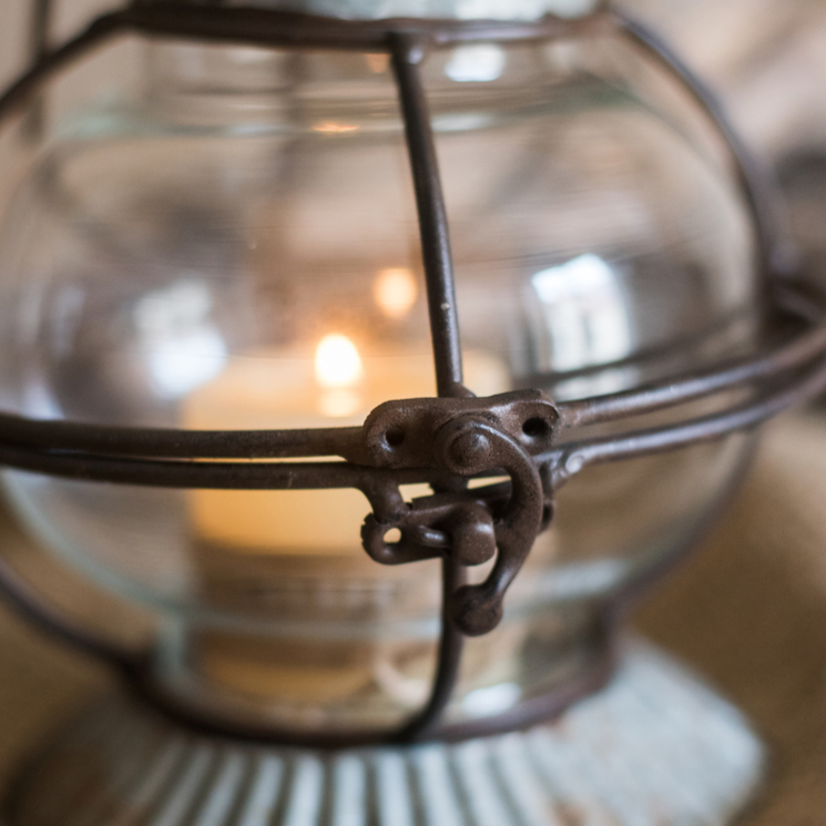 European Restoration Candle Holder in gray and rust, made of glass and metal, showcasing its elegant design and dimensions.