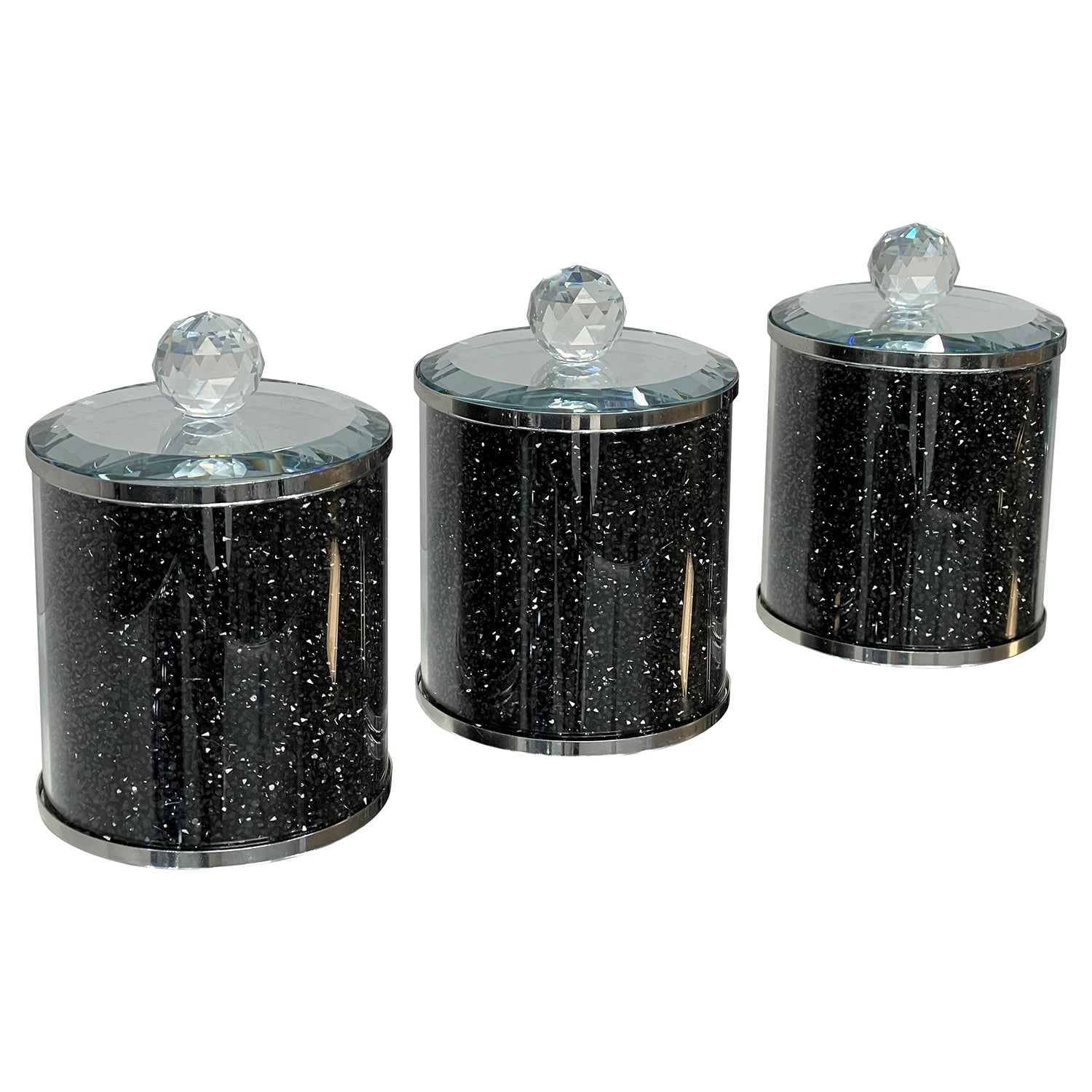 Exquisite three glass canister set featuring black crushed diamond glass with decorative chrome base and glass lids.