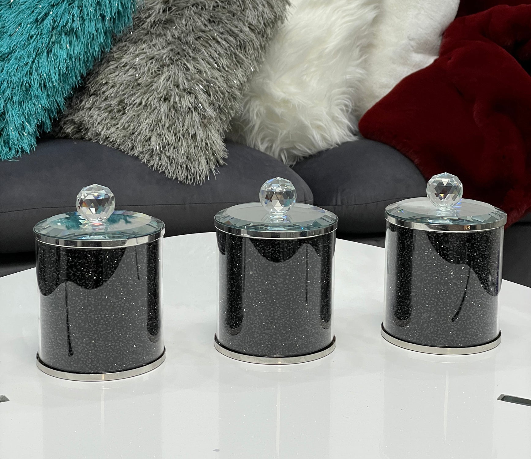 Exquisite three glass canister set featuring black crushed diamond glass with decorative chrome base and glass lids.