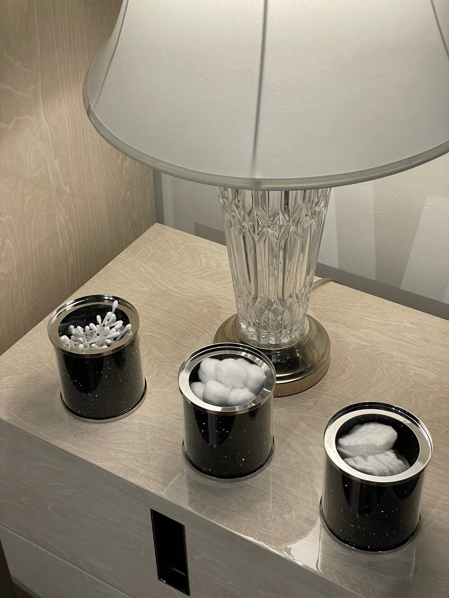 Exquisite three glass canister set featuring black crushed diamond glass with decorative chrome base and glass lids.