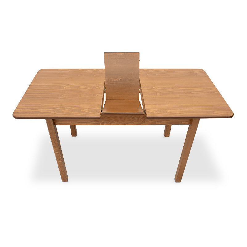 HORA Extendable Dining Table in walnut finish, showcasing its solid beech wood legs and MDF surface.