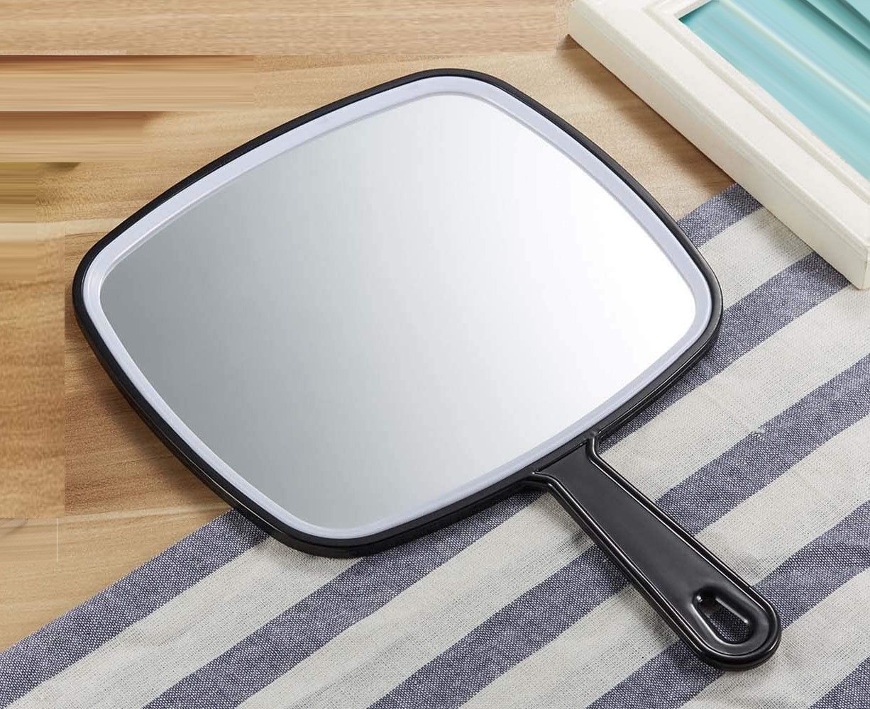 Extra Large Black Handheld Mirror with Handle, featuring a sleek design and large viewing surface for grooming.