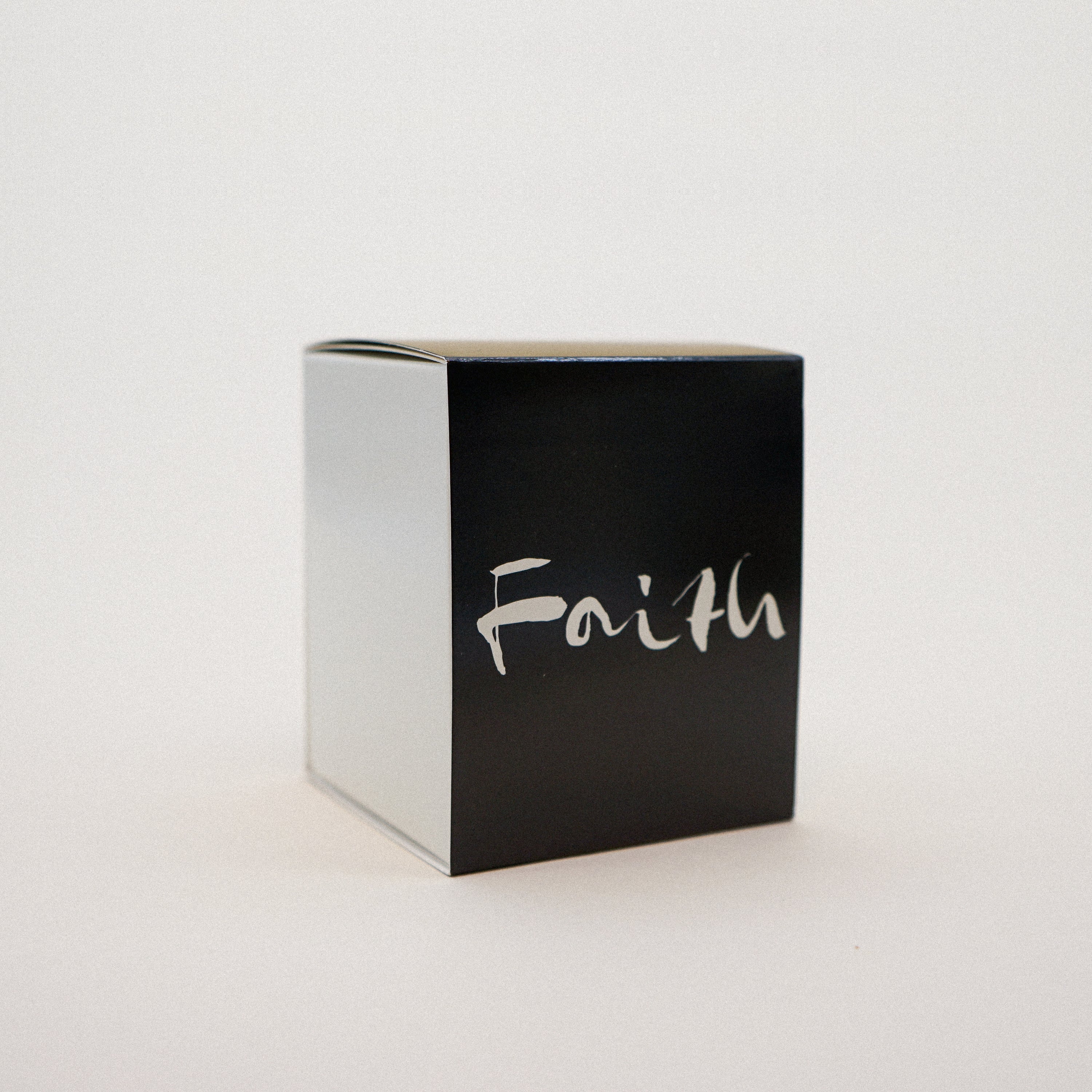 Faith Natural Wax Candle in black glass with faith brush painting design, showcasing a luxurious blend of essential oils.