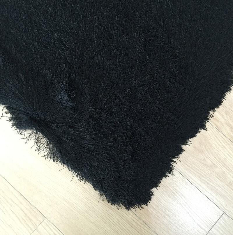 Fancy Collection Solid Black Shag Area Rug showcasing plush texture and elegant design, perfect for enhancing home decor.