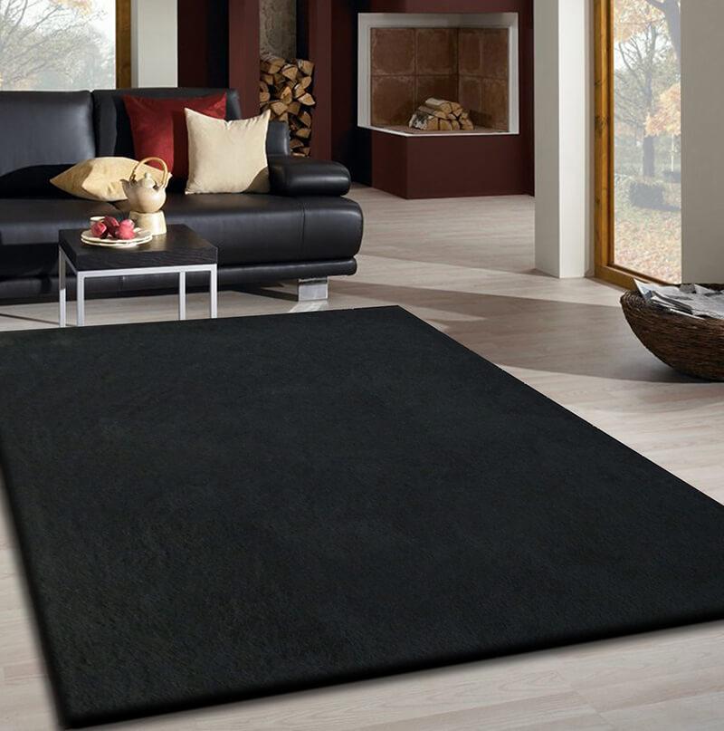 Fancy Collection Solid Black Shag Area Rug showcasing plush texture and elegant design, perfect for enhancing home decor.