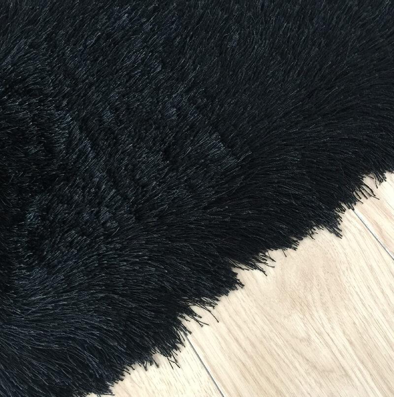 Fancy Collection Solid Black Shag Area Rug showcasing plush texture and elegant design, perfect for enhancing home decor.