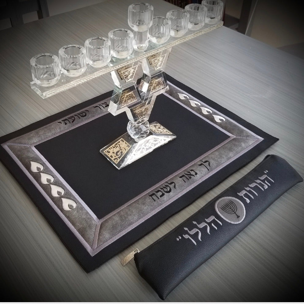 Elegant leather Menorah mat with embroidered Hanukkah phrases and matching shamash pouch, available in three colors.